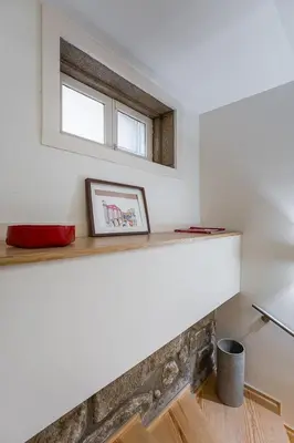 a shelf in a room with a window at GuestReady - Breyner Stonewall Haven in Porto