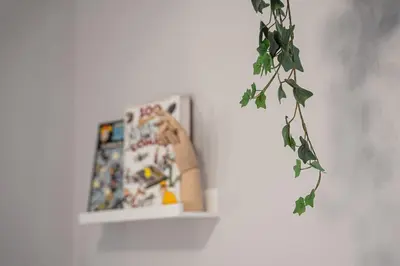 a shelf on a wall with a picture on it at GuestReady - A warm city refuge in Cedofeita in Porto