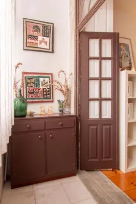 a room with a brown door and a cabinet at Porto 61 - Bright 2BR w/ Balcony by LovelyStay in Porto