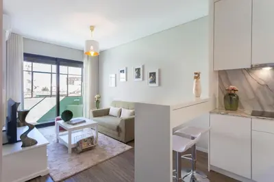 a white living room with a couch and a table at Urban Views - ML inspired by Torre dos Clérigos in Porto