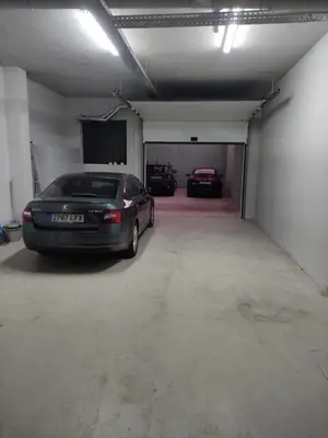 a car garage with two cars parked in it at Urban Views - ML 2Bed Apart Inspired by Casa da Música in Porto