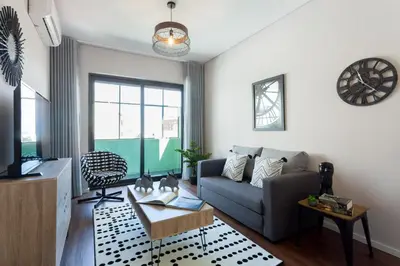 a living room with a couch and a table at Urban Views - ML 2Bed Apart Inspired by Casa da Música in Porto