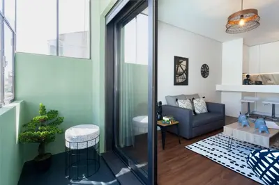 a living room with a couch and a chair at Urban Views - ML 2Bed Apart Inspired by Casa da Música in Porto