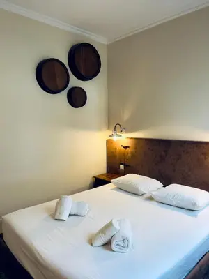 a bedroom with two towels on a bed at Stylish Flat City Center in Porto