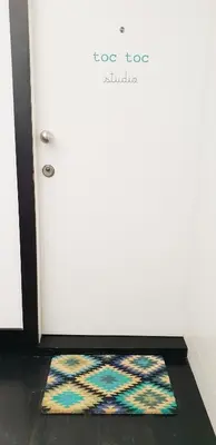 a door with a rug in front of a door at Toctoc Studio in Porto