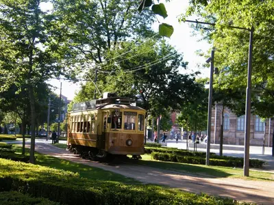 an old trolley car on a street in a park at Toctoc Studio in Porto
