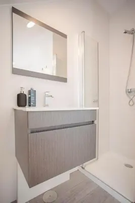 a bathroom with a sink and a mirror at Liiiving in Porto - Secret Grove Mezzanine in Porto