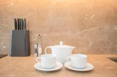 two cups and a tea pot on a table at Liiiving in Porto - Crystal Palace Apartment in Porto