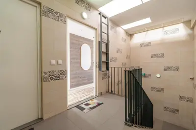 a bathroom with a door leading to a walk in shower at Host Wise - Amadeo Apartments in Vila Nova de Gaia