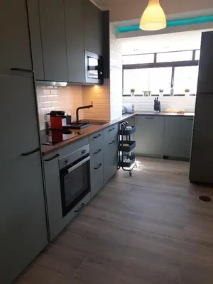 a kitchen with a sink and a stove top oven at BEST View DOURO PORTO Penthouse in Vila Nova de Gaia
