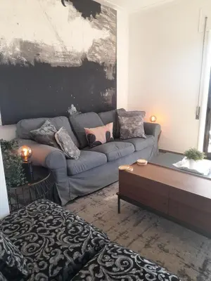 a living room with a couch and a coffee table at BEST View DOURO PORTO Penthouse in Vila Nova de Gaia