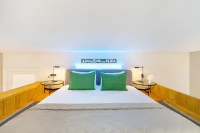 a bedroom with a large bed with two tables at WHome Central 1-Bed w/ Top View perfect to Explore Porto in Porto