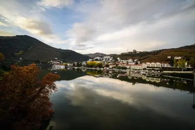 a view of a river with a town in the background at Porto Apartments in Porto