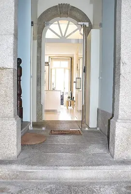 an archway leading into a room with a hallway at Benskins Loft Oporto Downtown in Porto