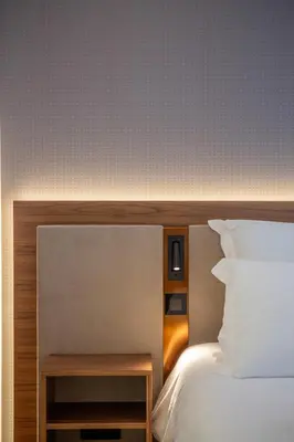 a bedroom with a bed and a nightstand next to a bed at Alliança Suites 1909 - Porto in Porto