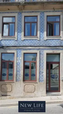 a building with a blue and white tile facade at New Life - TORRE CLÉRIGOS STUDIO-3T in Porto