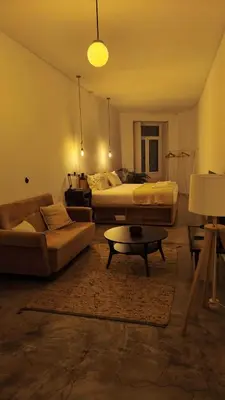 a living room with two beds and a coffee table at Babel in Porto