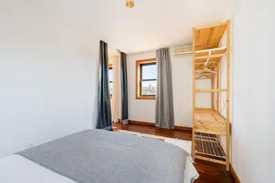 a bedroom with a bunk bed and a ladder at Hey Apartments A in Porto