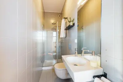 a bathroom with a sink and a toilet at Hey Apartments A in Porto