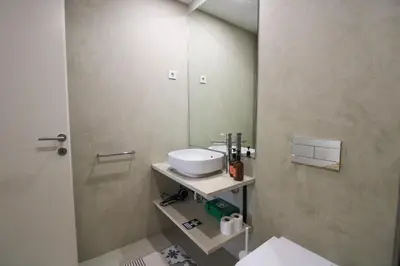 a bathroom with a sink and a mirror at La Vida in Porto Unique in Porto