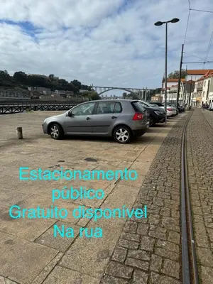 a silver car parked in a parking lot at luxury stay Romantic Douro River & Sunset views in Porto