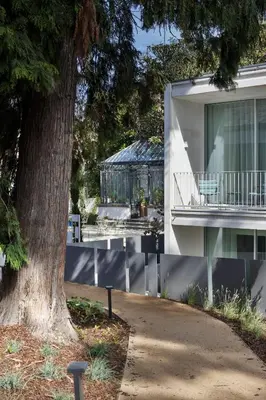 a courtyard with tables and chairs and a building at One Shot Palácio Cedofeita in Porto