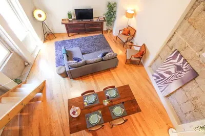 an overhead view of a living room with a couch at Mouzinho Mezzanine in Porto