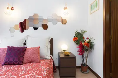 a bedroom with a bed with a geometric headboard at Host Wise - Cool Flat - City Center near Aliados in Porto