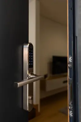 a door with a door handle with a television in a room at Coruja’s House AL OPO in Porto