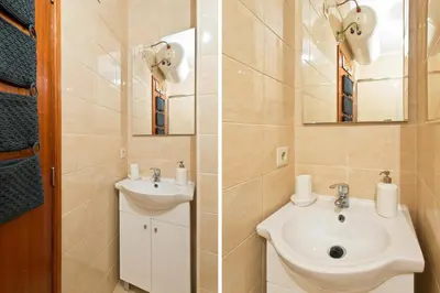 a bathroom with a sink and a mirror at Host Wise - Spacious Trendy Flat w Netflix - Central Location in Porto