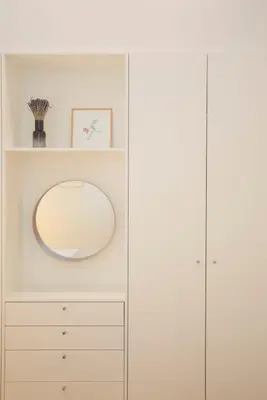 a dressing room with a mirror and a white cabinet at Liiiving in Porto - Haven Pool Apartment in Porto