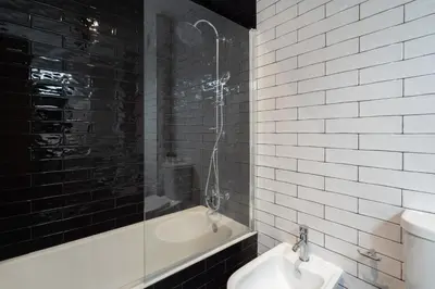 a bathroom with a tub and a toilet and a sink at Host Wise - Fantastic Peaceful Flat in Gaia in Vila Nova de Gaia