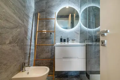 a bathroom with a sink and a mirror at Large Terrace in Paraiso III in Porto