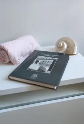 a book sitting on top of a table at Boavista Luxury Villas in Porto