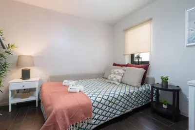 a small bedroom with a bed and a window at Host Wise - Impressive Restful Houses in Porto