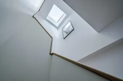 a staircase in a house with a window at Nomads Lux - 1BDR Charming Top Floor Porto in Porto