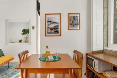 a living room with a table with glasses on it at Host Wise - Lovely Shinny Flats with Balcony - Clerigos in Porto