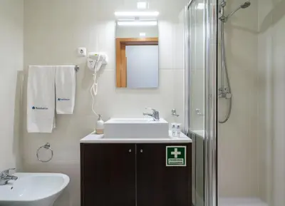 a bathroom with a sink and a shower at Host Wise - Bright Quiet Flats - Prime Location in Porto