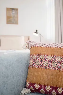 a close up of a pillow on a bed at Liiiving in Porto - Urban Art Apartment in Porto
