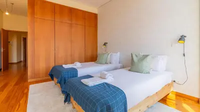 a hotel room with two beds in a room at Bento Living by LovelyStay in Porto