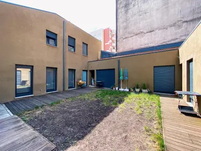 an empty courtyard of a building with a patio at Casas S. Dinis in Porto