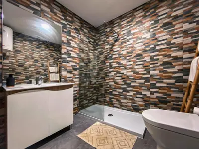 a bathroom with a toilet and a sink and a shower at Casas S. Dinis in Porto