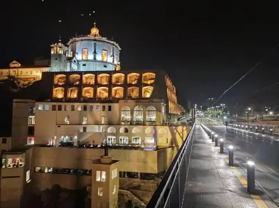 a building with a tower on top of it at night at Loft in the historic center of Oporto downtown in Porto
