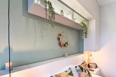 a room with a shelf with plants on it at Julio Dinis Porto Secret Retreat - by Guest SPA in Porto