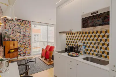 a kitchen with a sink and a counter top at Theater Studio in Porto