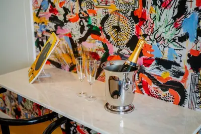 a table with two champagne bottles and glasses on it at Theater Studio in Porto