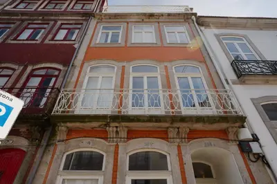 a building with a balcony on the side of it at Theater Studio in Porto