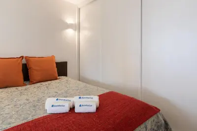 a bedroom with a bed with two towels on it at Host Wise - Charming Welcoming Flat - Centrally Located in Porto