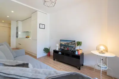 a living room with a couch and a table at Host Wise - Charming Welcoming Flat - Centrally Located in Porto