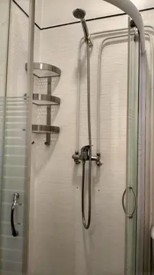 a shower in a bathroom with a glass door at Trindade City Studio 77 in Porto